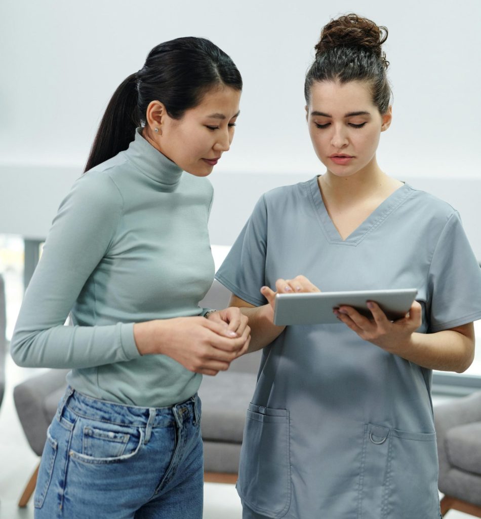 Two clinicians perform medical quality assurance.